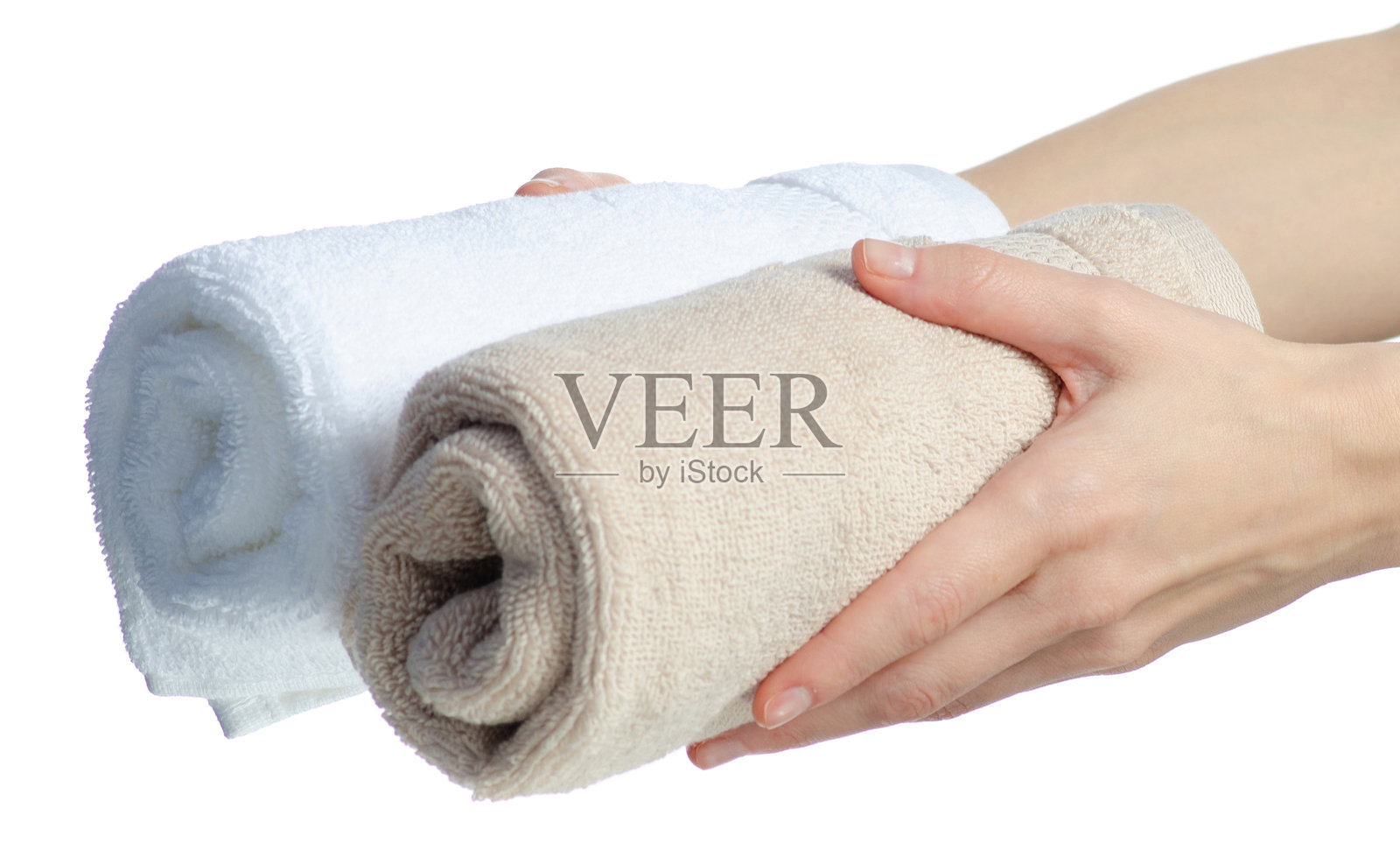 手中拿着米色和白色的卷毛巾照片摄影图片