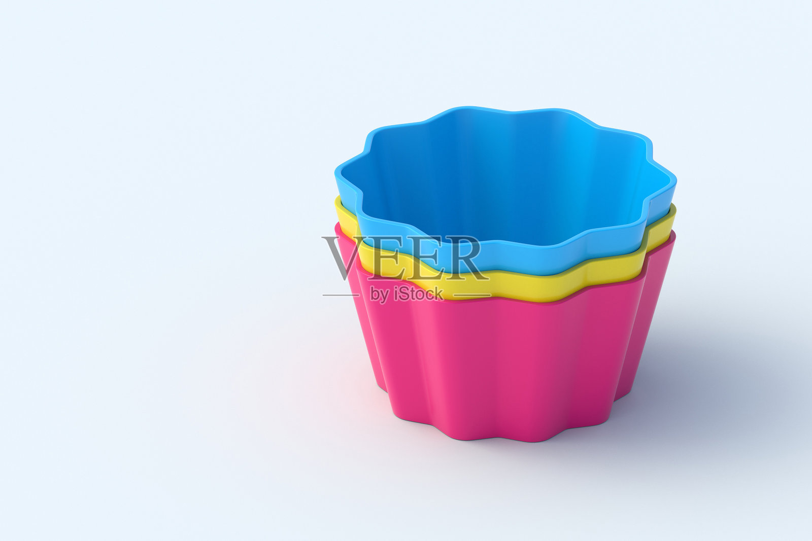 浅灰色背景上的一堆硅胶模具，用于松饼或杯子蛋糕。烘焙工具。烹饪配件。留白。3D渲染。照片摄影图片