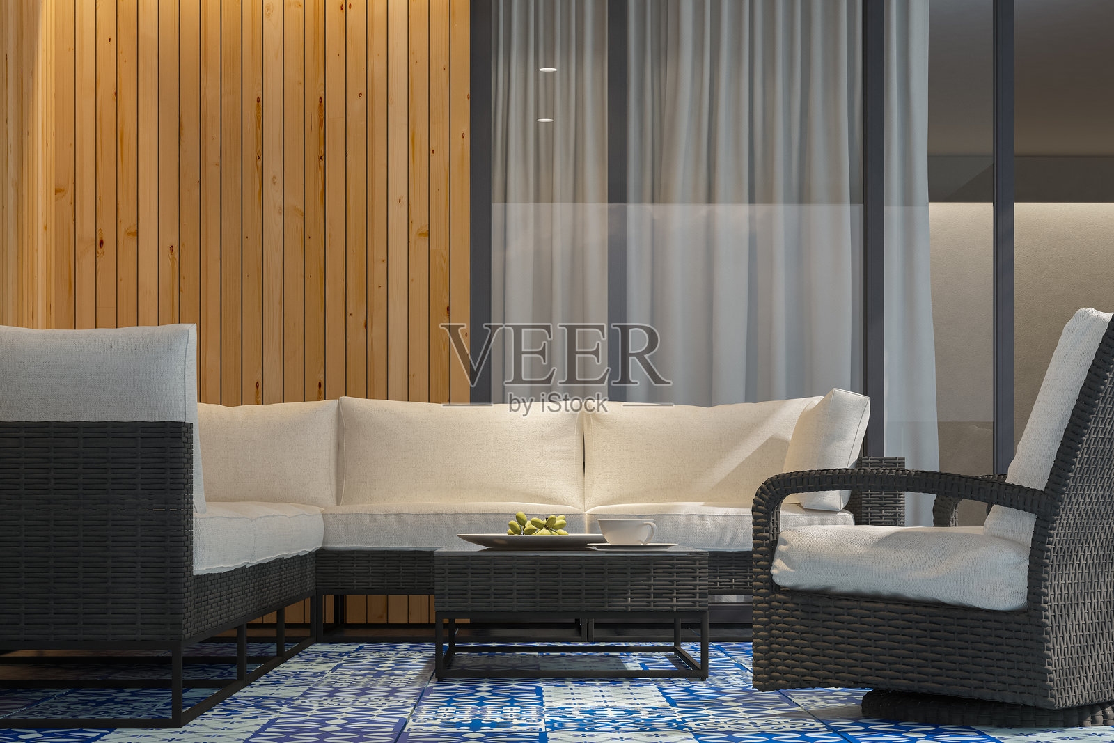 现代露台配有黑色藤制家具和摩洛哥蓝色瓷砖地板照片摄影图片