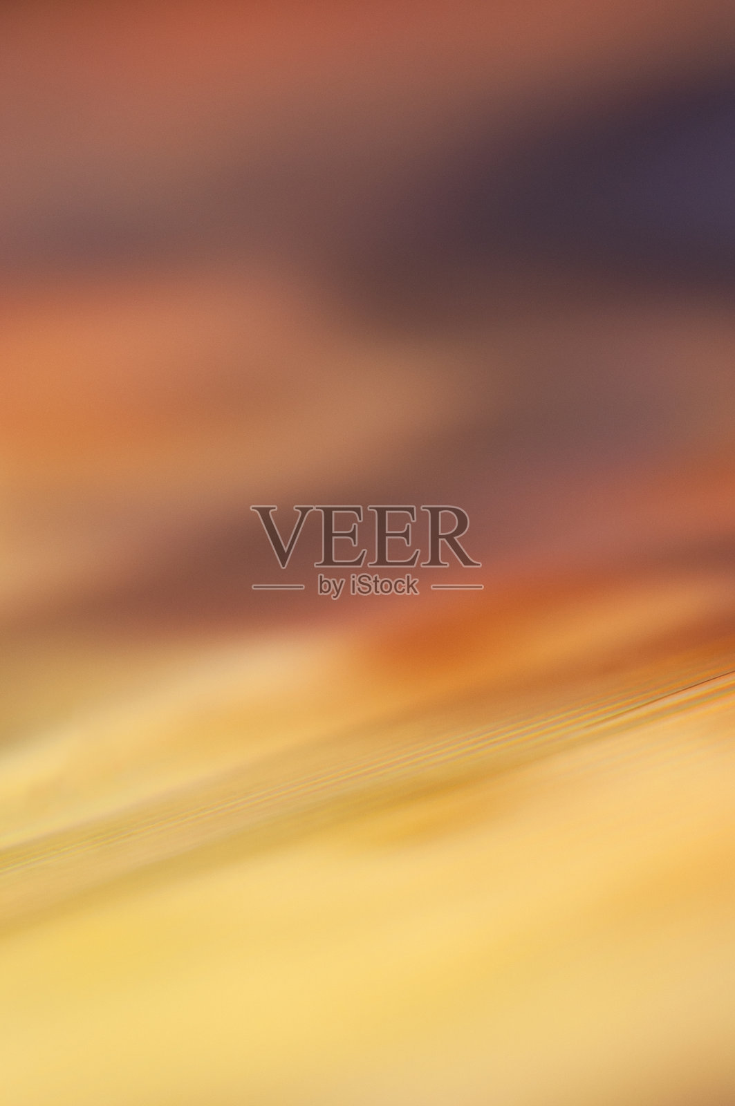 色彩斑斓的抽象设计，展示了日落时温暖色调的融合照片摄影图片