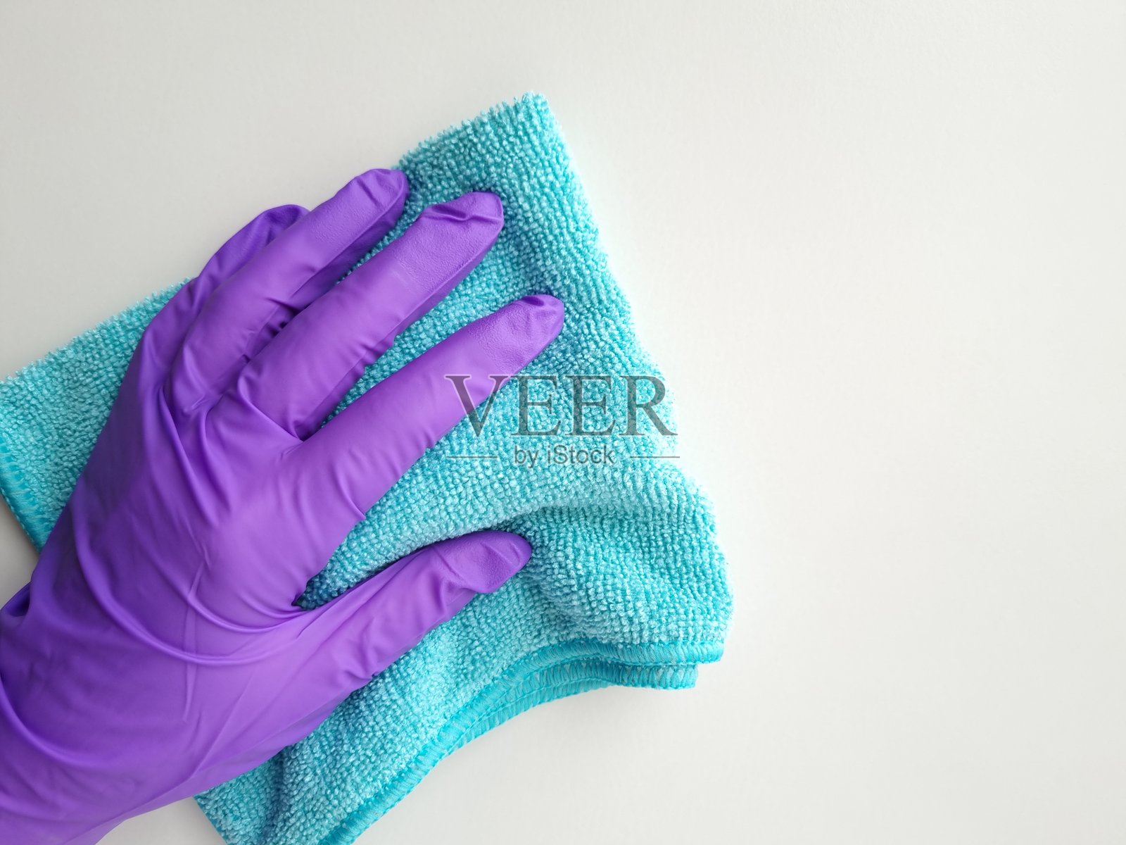 手握抹布的特写镜头照片摄影图片