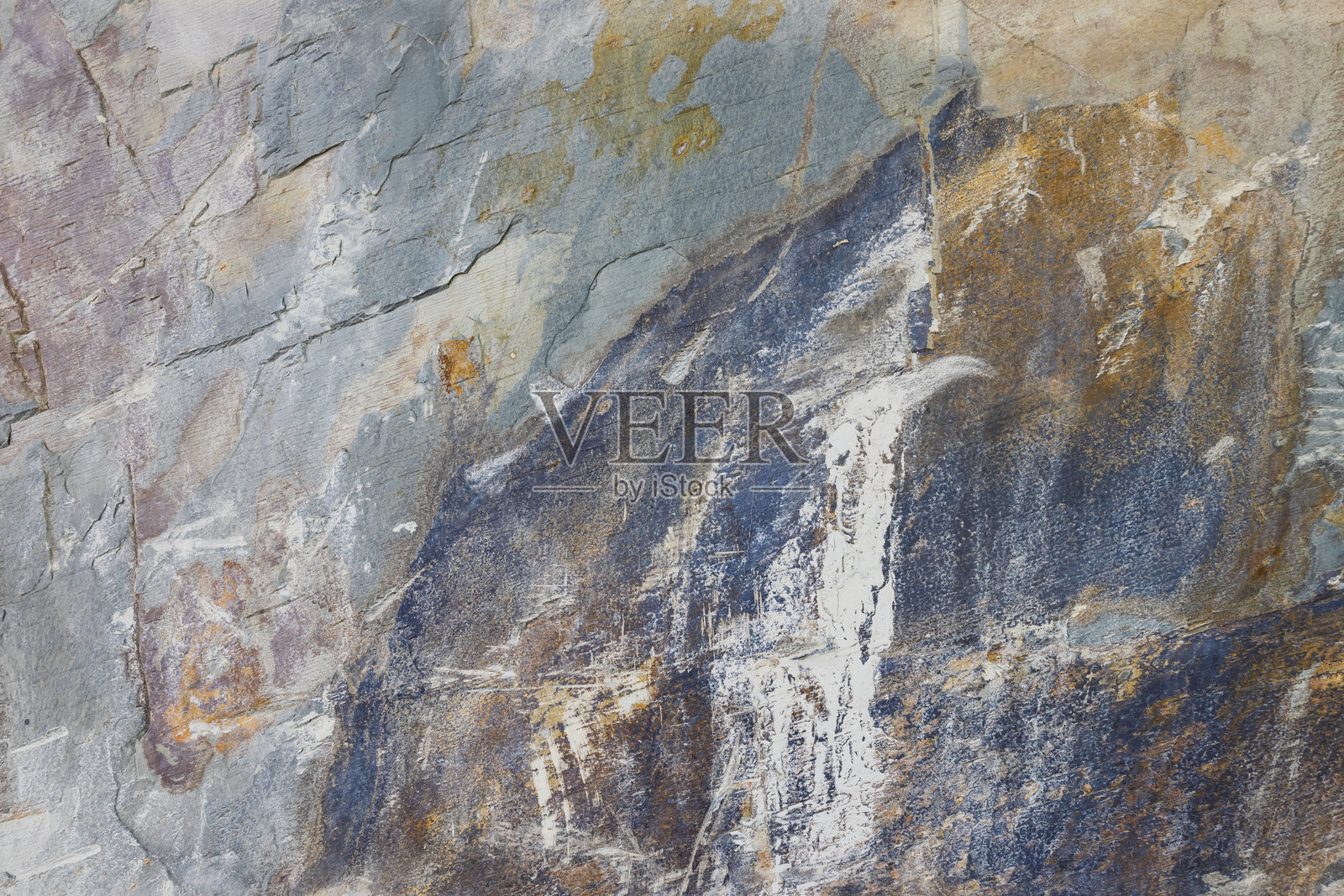 粗糙石材表面的特写，展现多种土色调的图案照片摄影图片