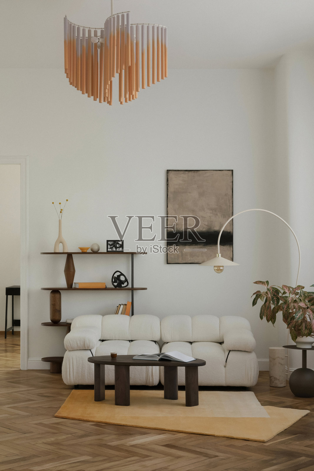 现代客厅，配有抽象艺术、白色毛圈沙发和图形细节，营造出温馨的现代氛围。照片摄影图片