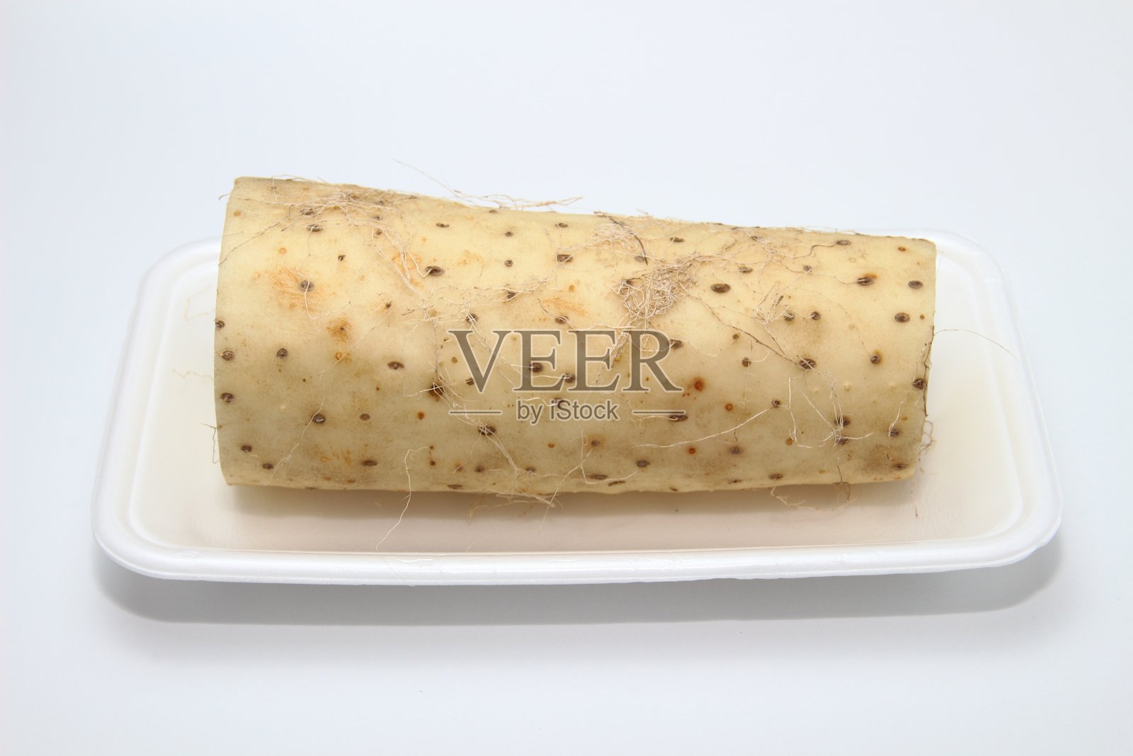 光滑的白色肌肤，富含营养的地球珍宝，日本山药。照片摄影图片