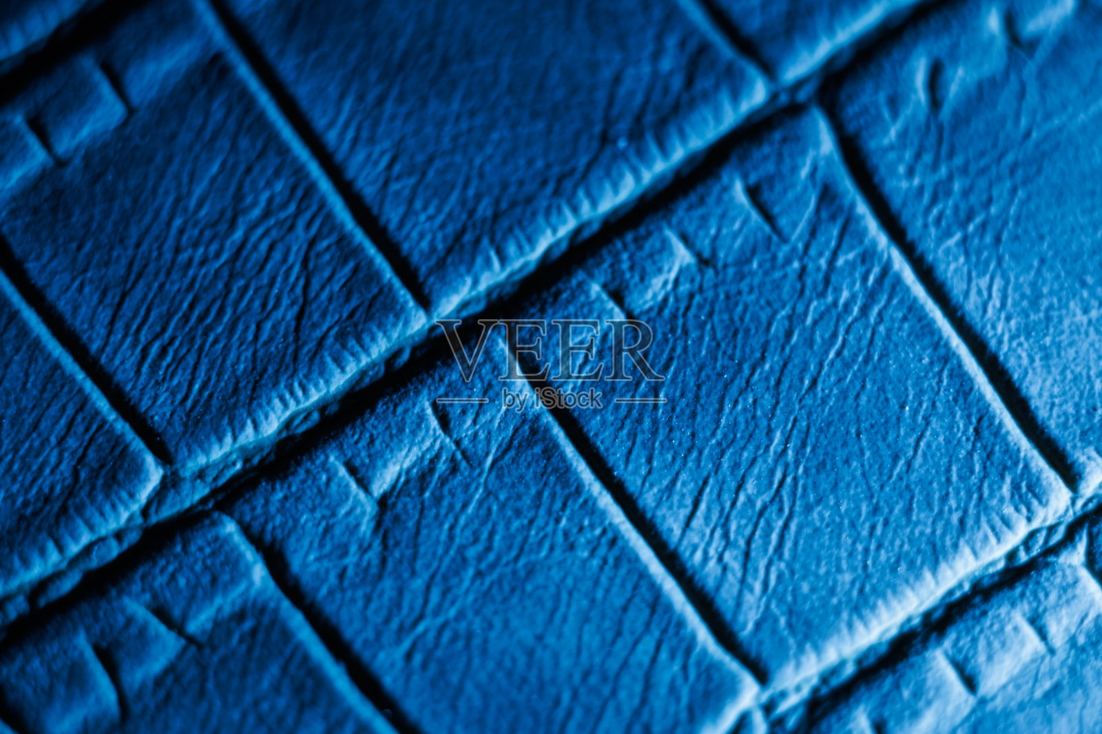 蓝色纹理皮革表面的特写照片摄影图片