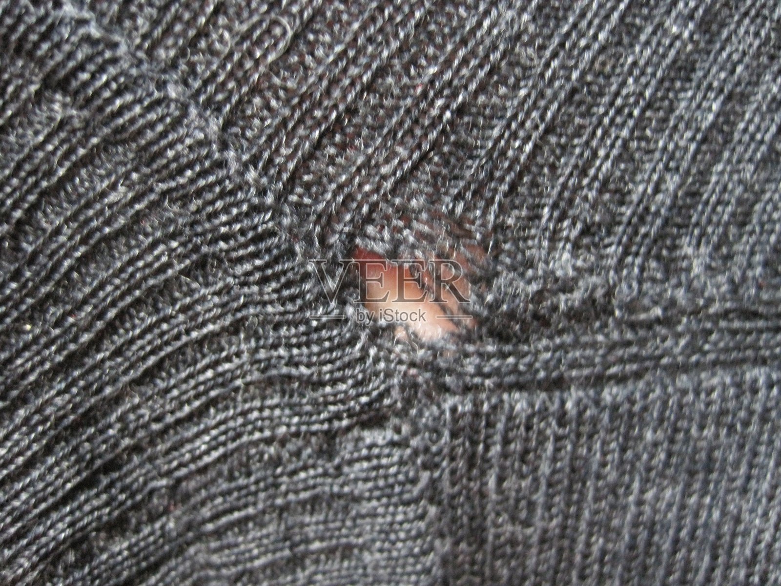 被昆虫啃食的毛衣照片摄影图片