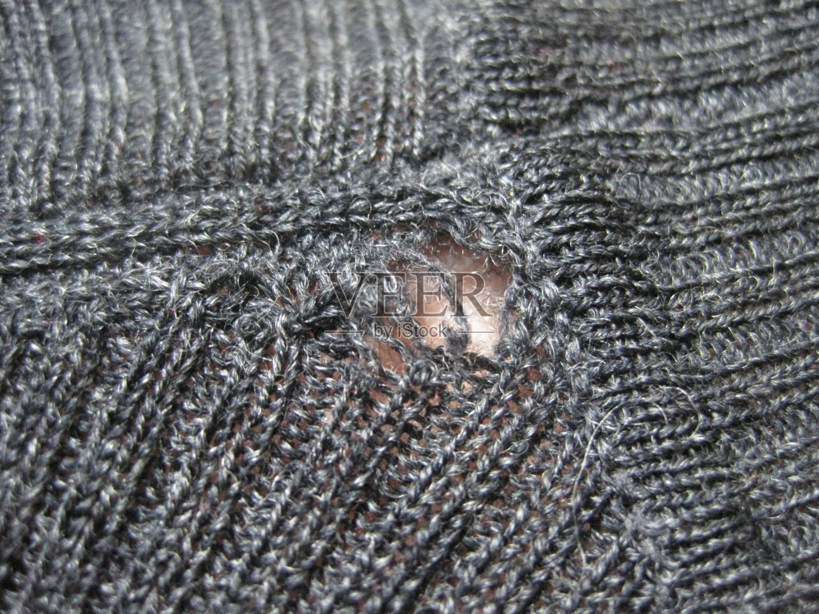 被虫子啃过的毛衣照片摄影图片