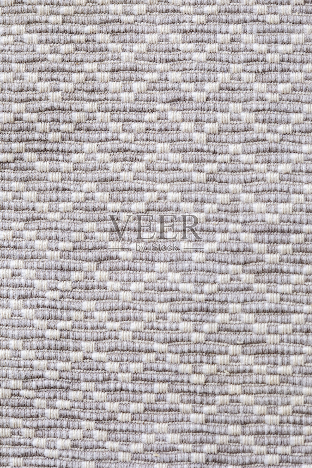 白色和灰色图案地毯的特写镜头照片摄影图片