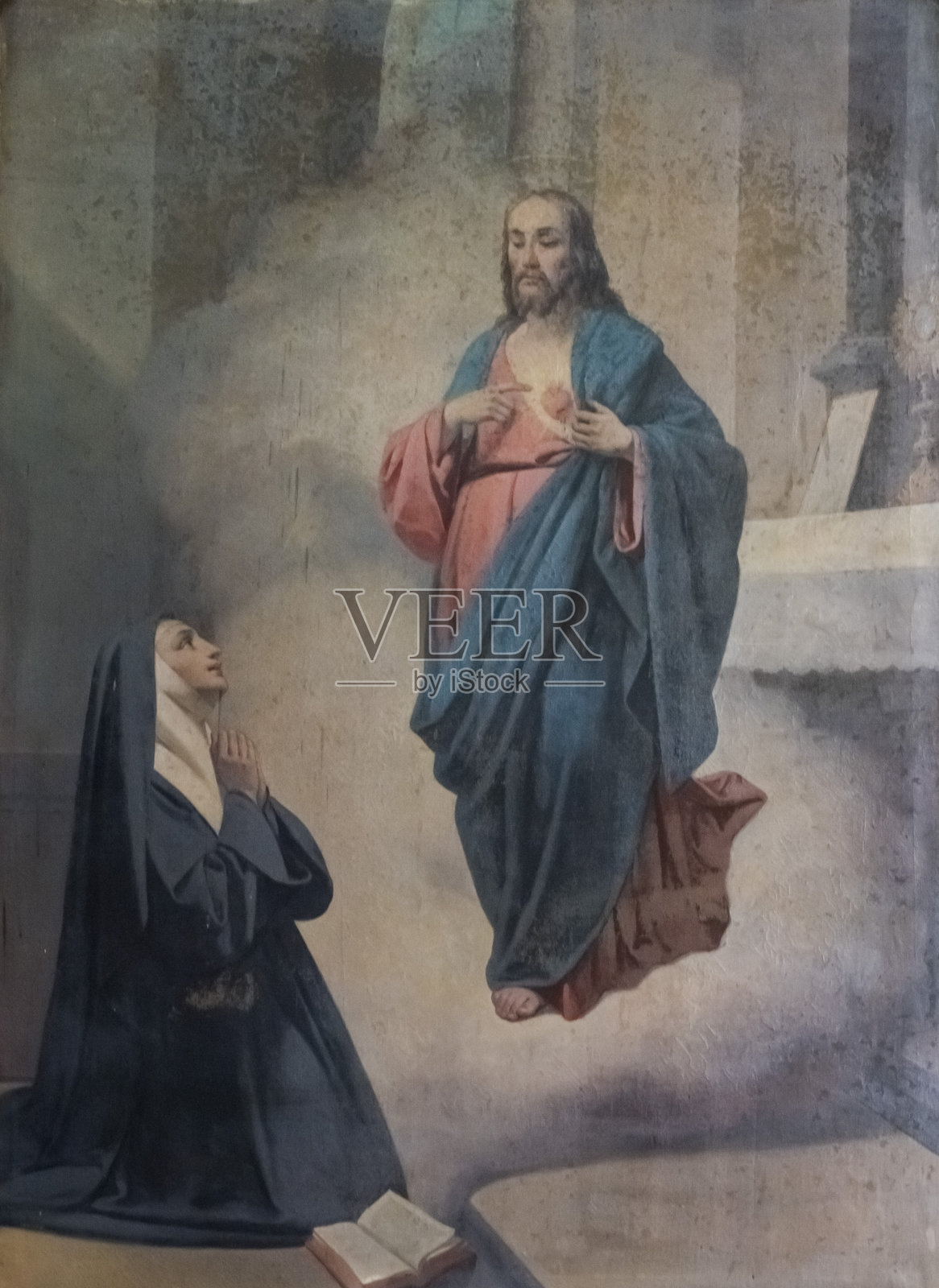 19世纪的画作:耶稣基督圣心显现给圣玛格丽特·玛丽·阿拉科克。照片摄影图片