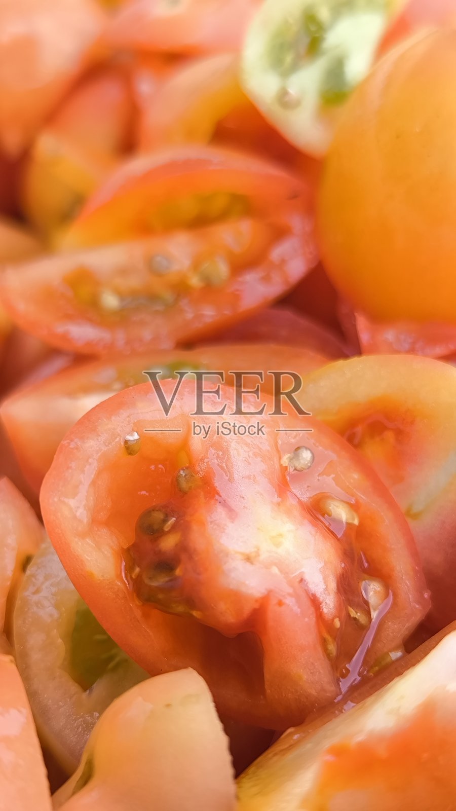 切好的番茄作为背景。准备番茄用于烹饪。照片摄影图片