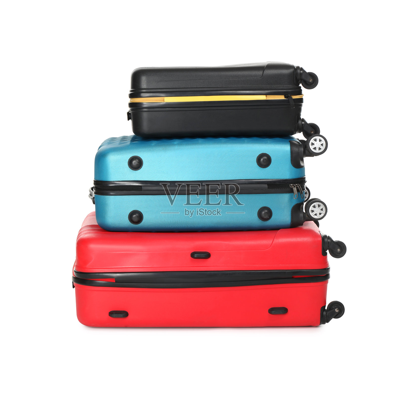 一堆色彩斑斓的行李箱，孤立在白色背景上照片摄影图片