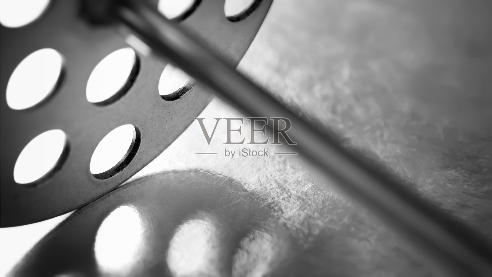 厨房工具。抽象构图。金属厨房工具的宏观纹理，浅景深。照片摄影图片