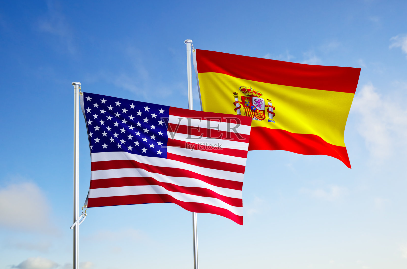 西班牙和美国的国旗在蓝天背景下。照片摄影图片