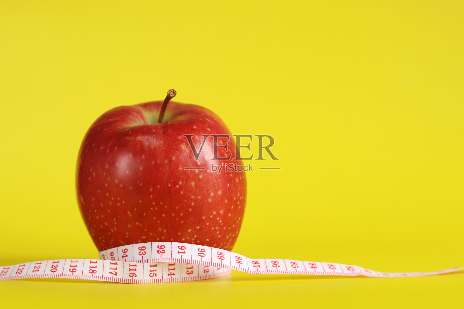 卷尺和苹果。饮食照片摄影图片