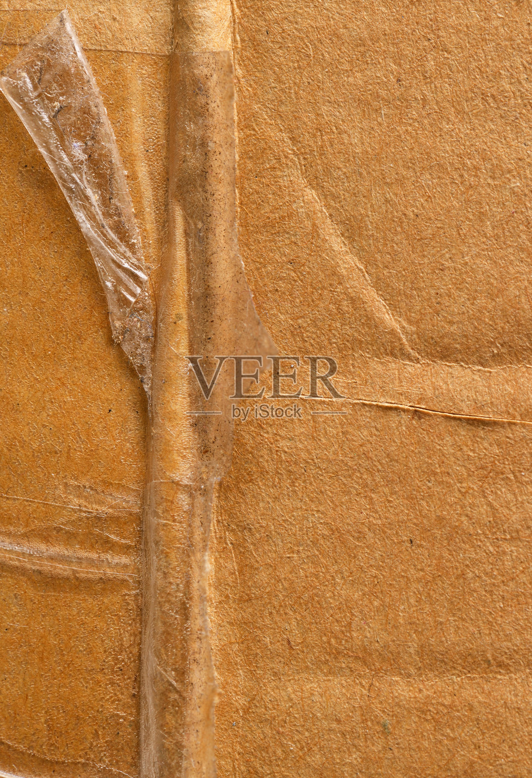 带有胶带的圆形抽象纸板。照片摄影图片