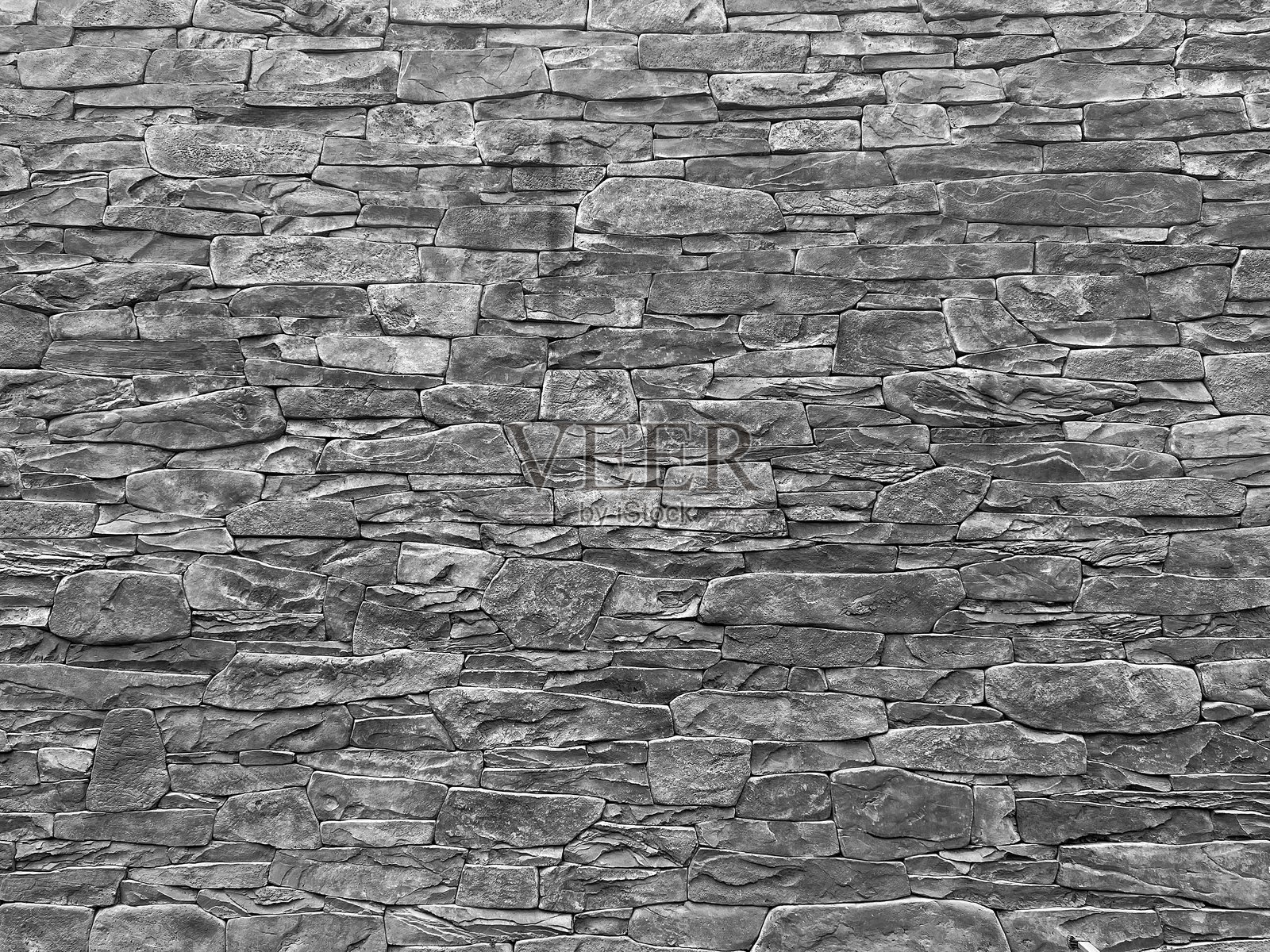 由旧石块砌成的砖石结构。照片摄影图片