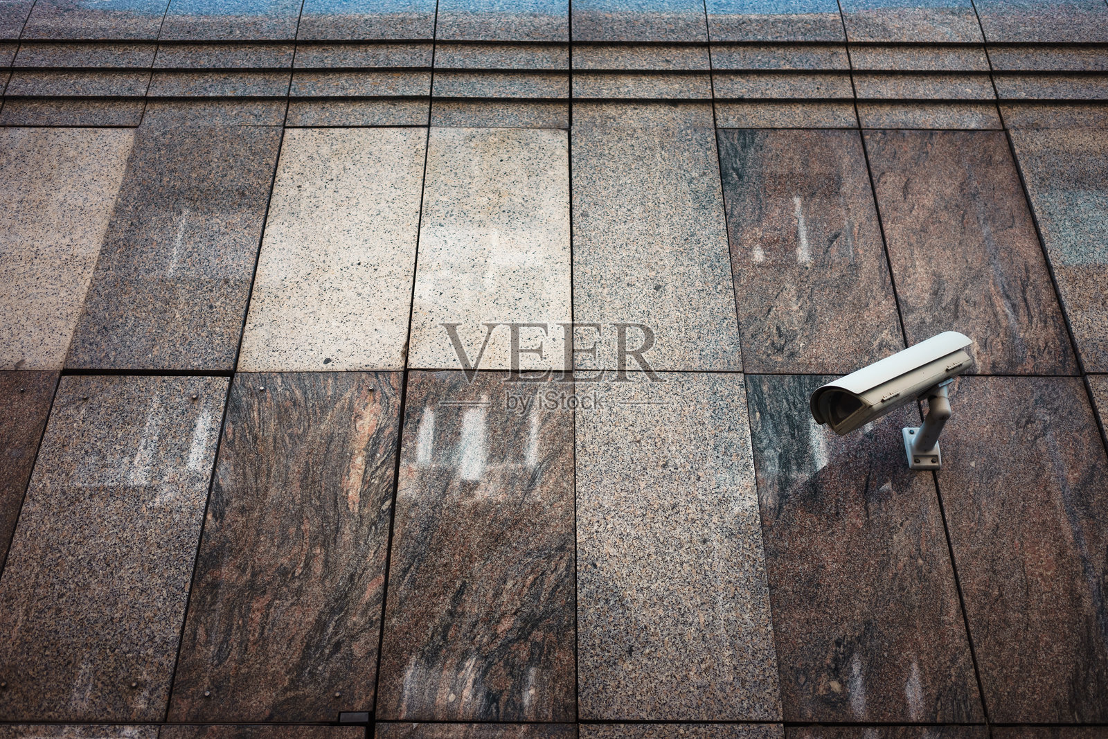 大理石墙上的监控摄像头照片摄影图片