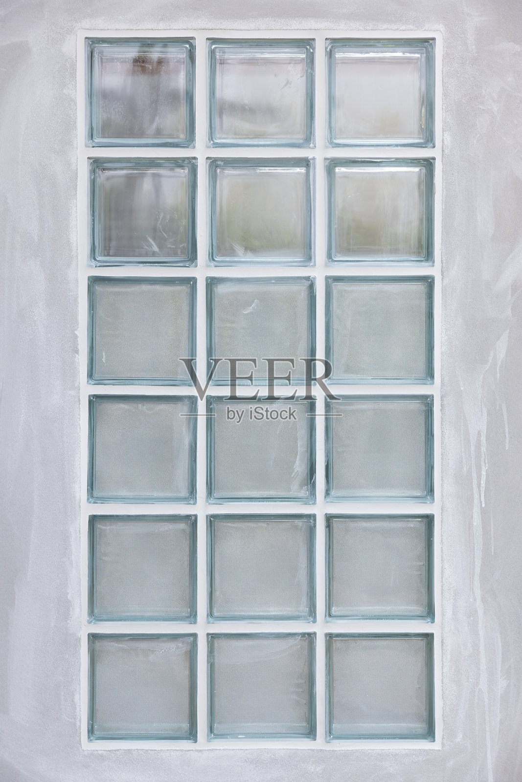 透明玻璃砖和混凝土墙。照片摄影图片