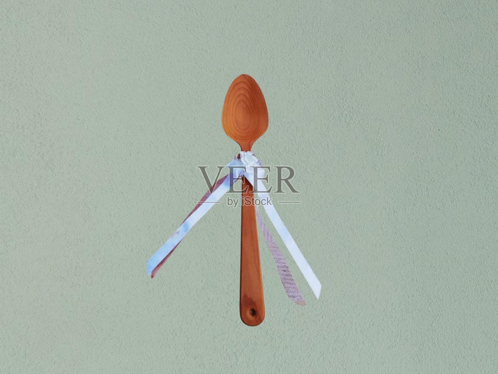 这个食物勺是用柚木制成的。照片摄影图片