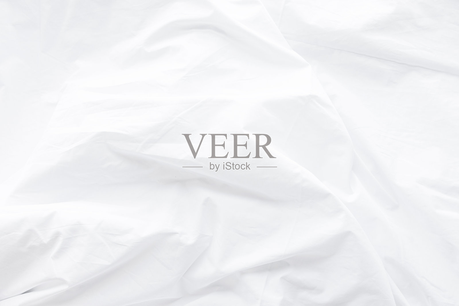 洁白的床单，干净清爽，柔软光滑的质地，营造出简约通透的背景，完美的纺织细节，清新卫生，舒适温馨，给人以温柔的绒毛般的舒适感，采用棉质面料。照片摄影图片