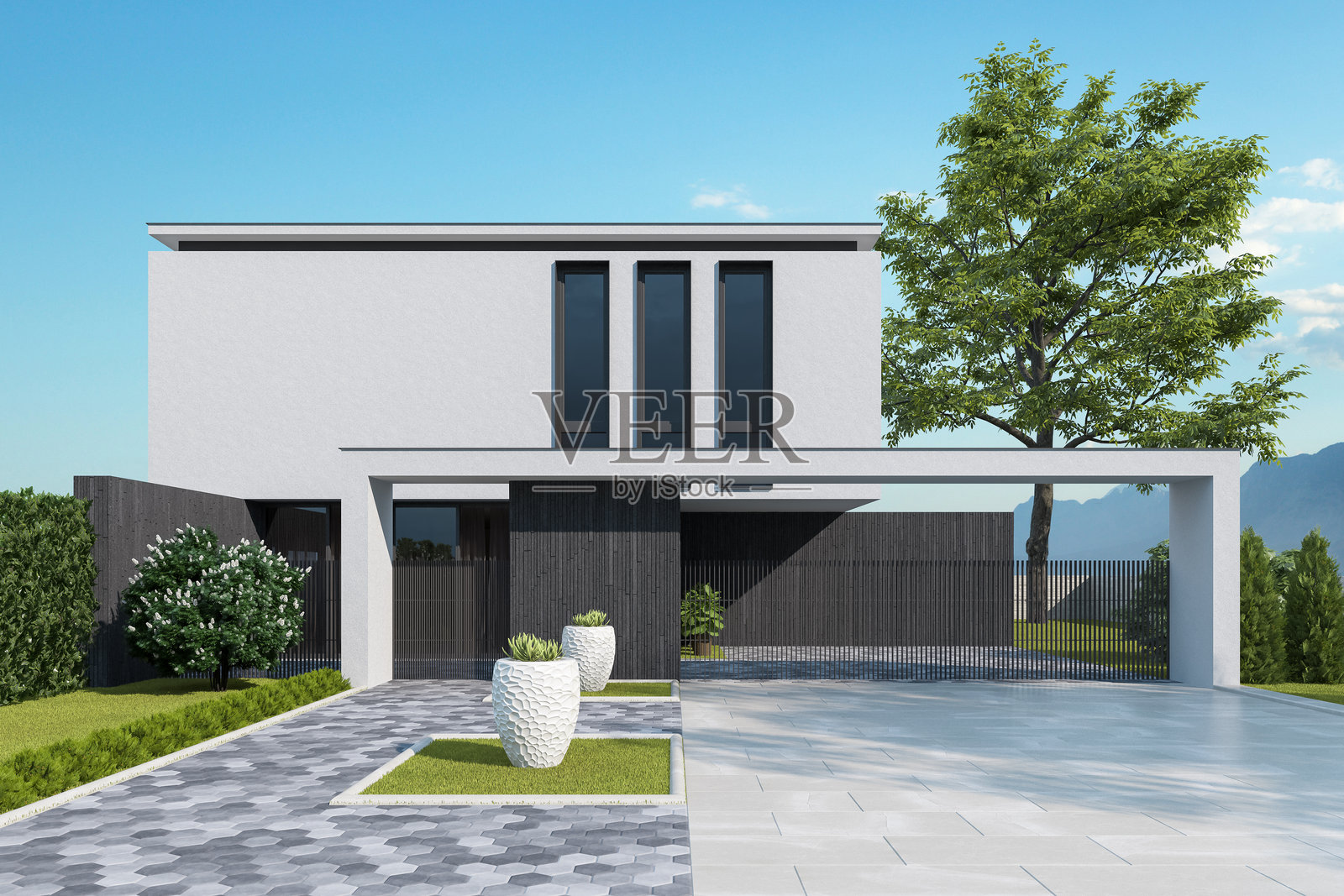 现代两层住宅，黑色石材底座和白色灰泥外立面照片摄影图片