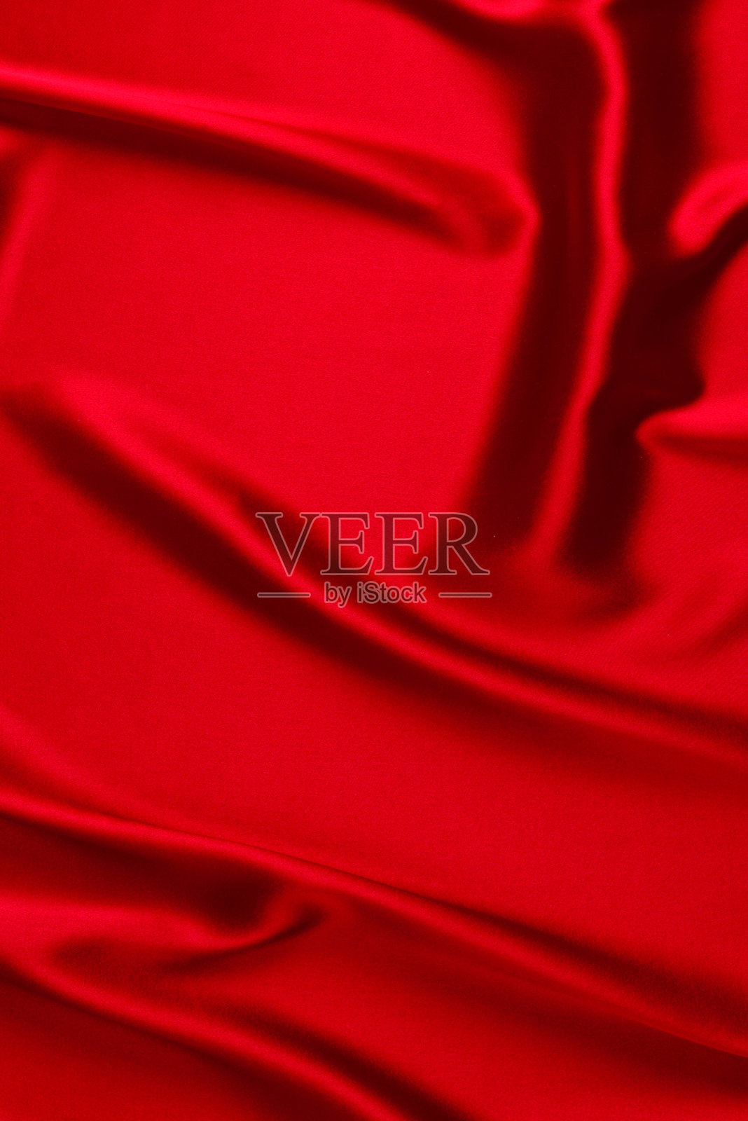 红色丝绸或缎面奢华面料纹理，可用作抽象背景。俯视图照片摄影图片