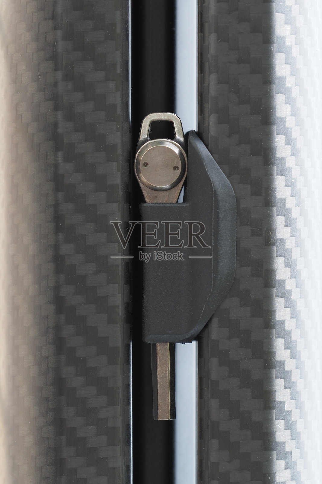 六角钥匙与摄影三脚架。三脚架上的外星钥匙。照片摄影图片