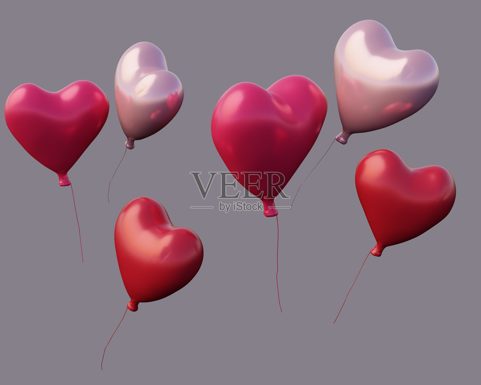 一些红色和粉色的心形气球在空中飘浮。照片摄影图片