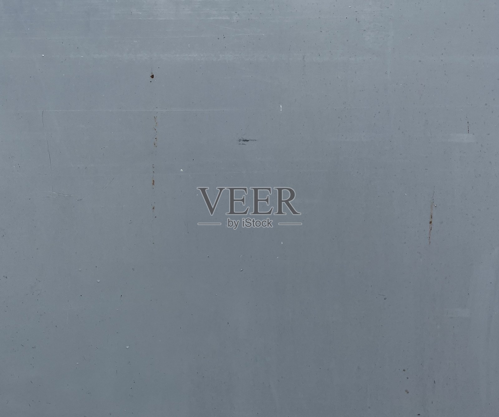 简约的灰色金属表面，带有细微划痕和风化的铜绿照片摄影图片