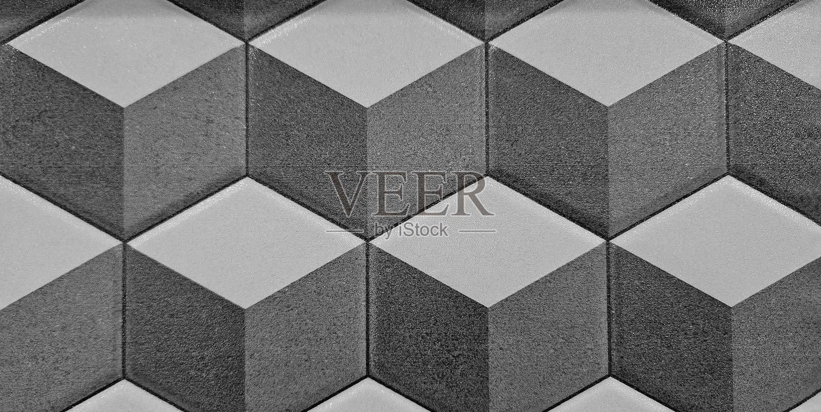 灰色和黑色几何形状的无缝图案墙面或背景。灰色瓷砖地板。照片摄影图片