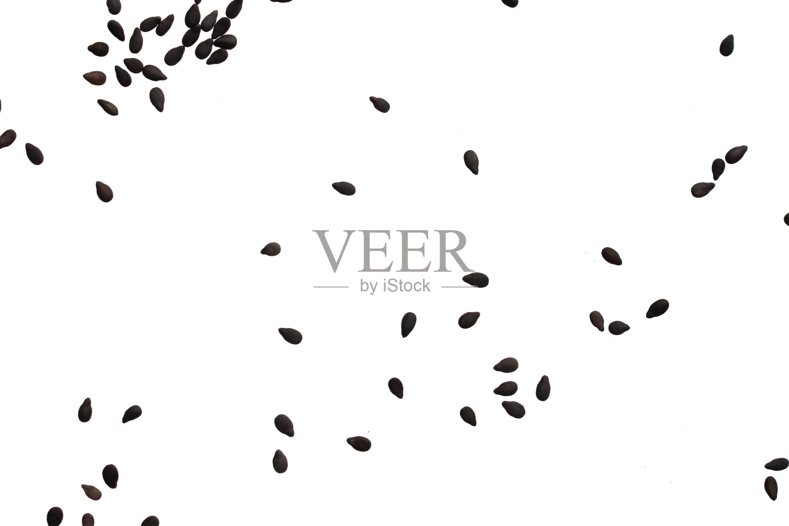 白色背景上的黑芝麻种子照片摄影图片