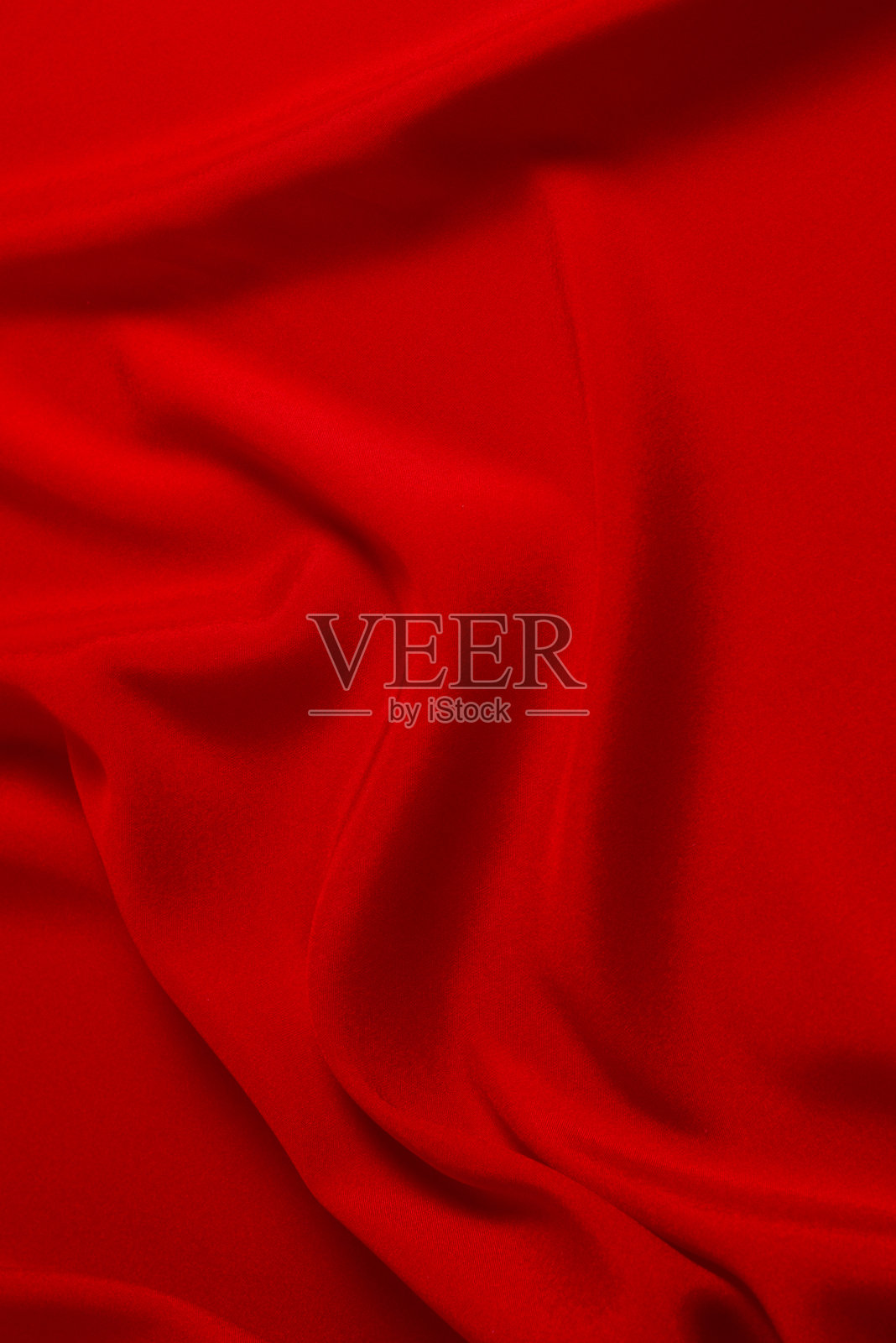 红色丝绸或缎面奢华面料纹理，可用作抽象背景。俯视图。照片摄影图片