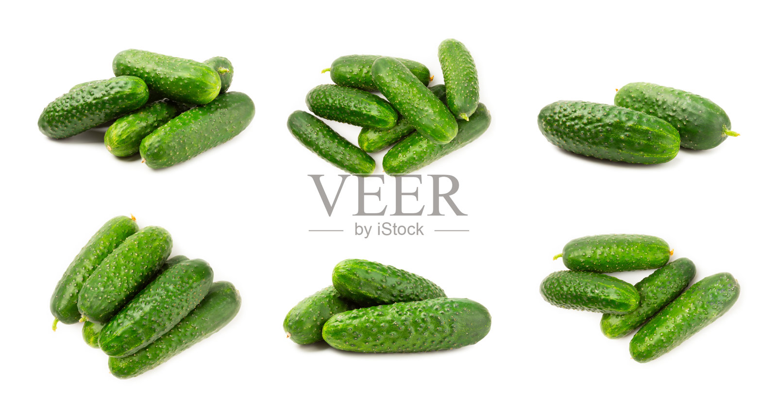 白色背景上的黄瓜。白色背景上的黄瓜切片。新鲜有机绿色黄瓜。素食。沙拉的配料。农场蔬菜。照片摄影图片