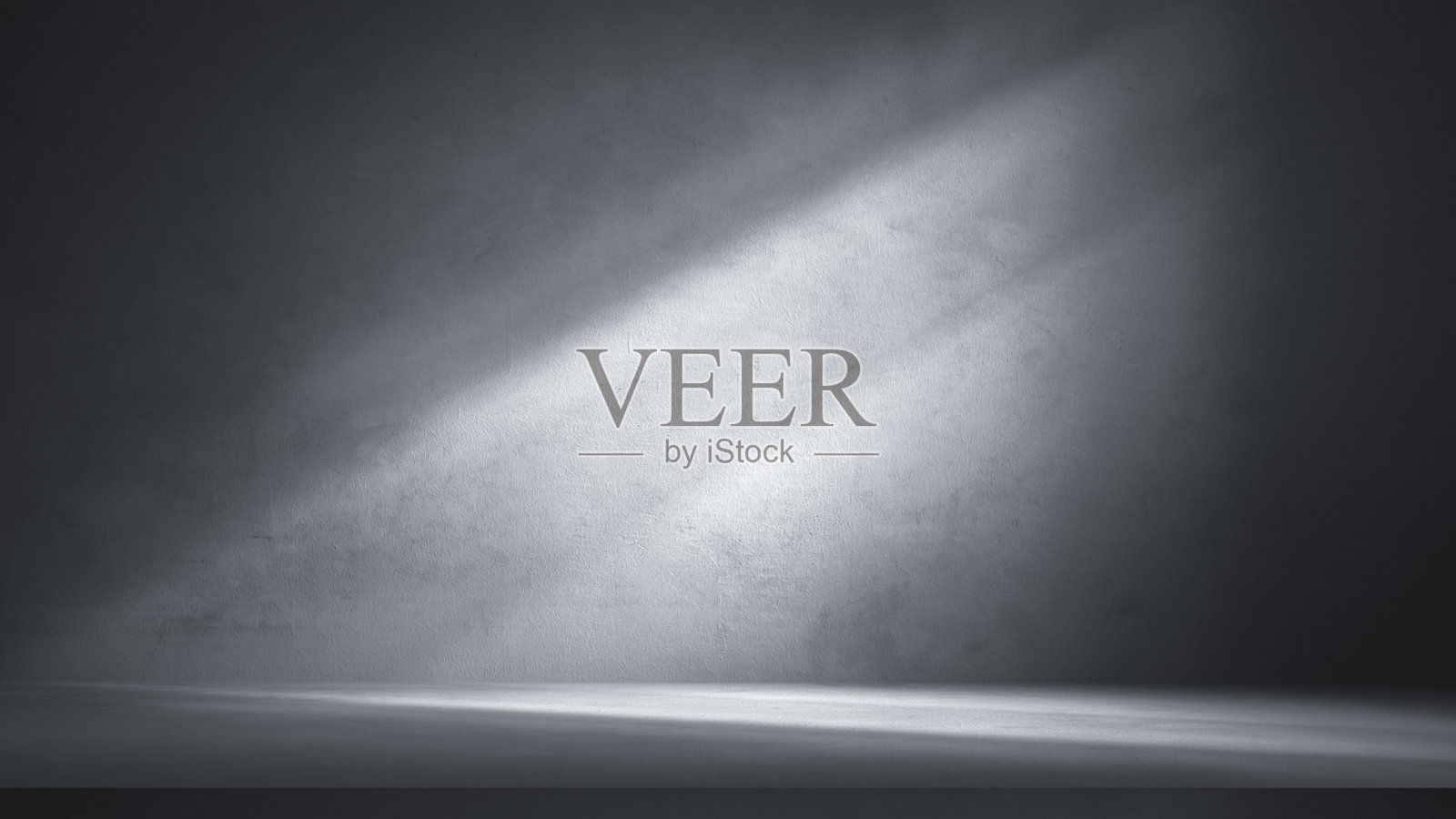 戏剧性的灰色混凝土墙壁和地板，带有斜射光束，完美适合作为抽象产品背景、工业展示或极简风格的演示。照片摄影图片