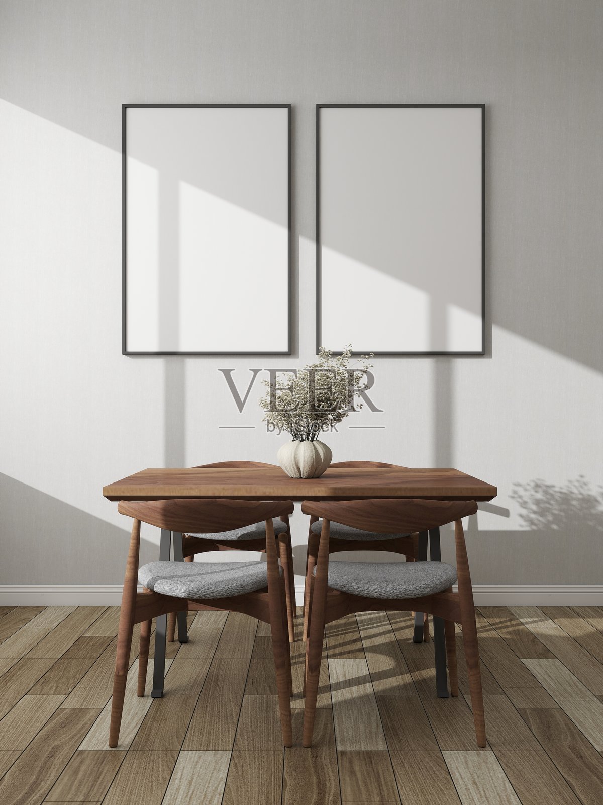 现代餐厅，白色墙壁上有两个竖框样板，旁边是一个装饰性边柜和桌子。照片摄影图片