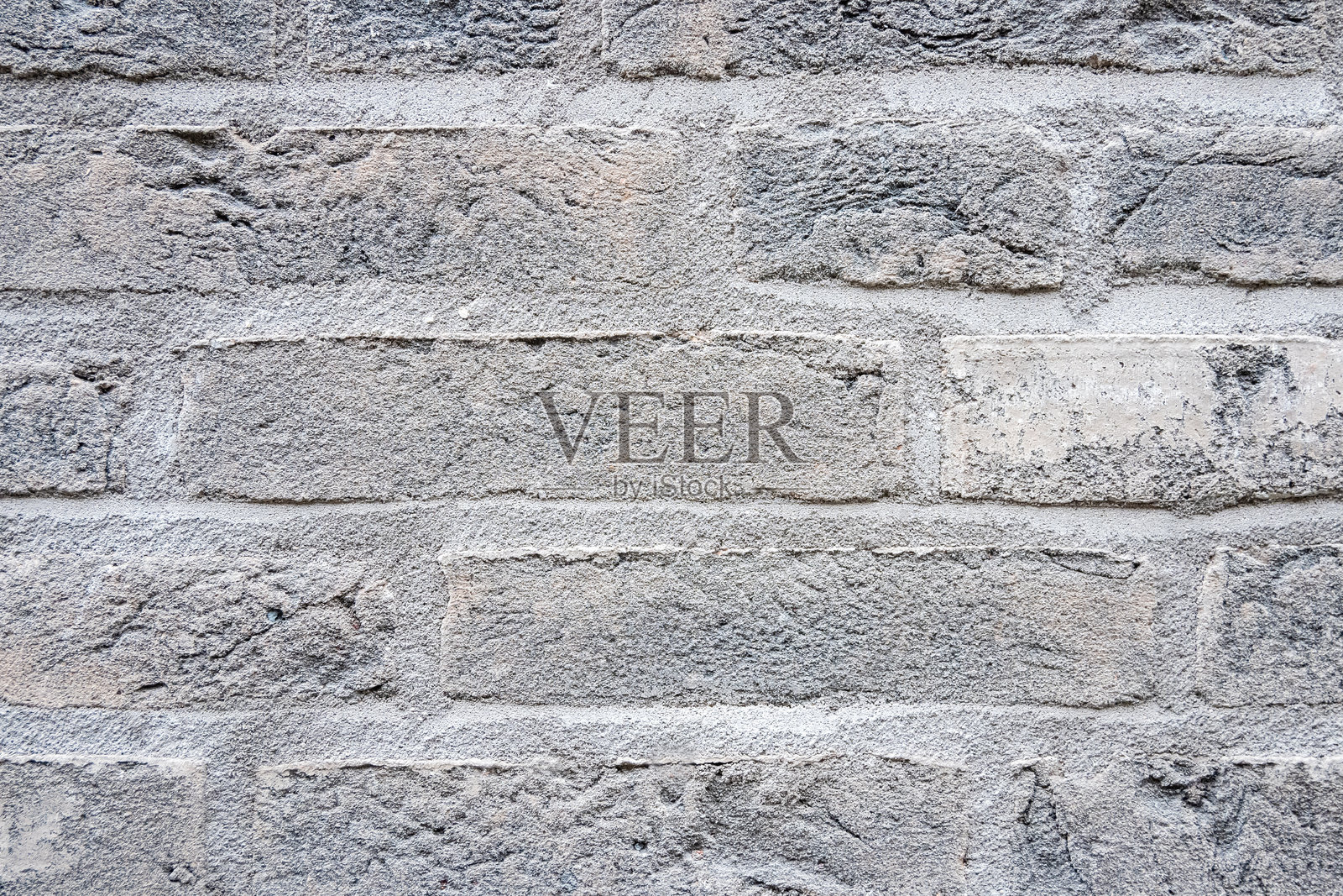 现代建筑的石墙，使用了许多灰色砖块。照片摄影图片