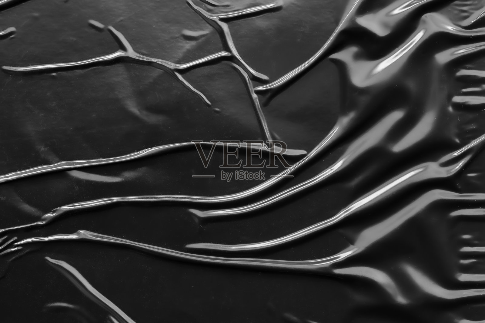 黑色皱褶和折痕的塑料海报纹理背景照片摄影图片