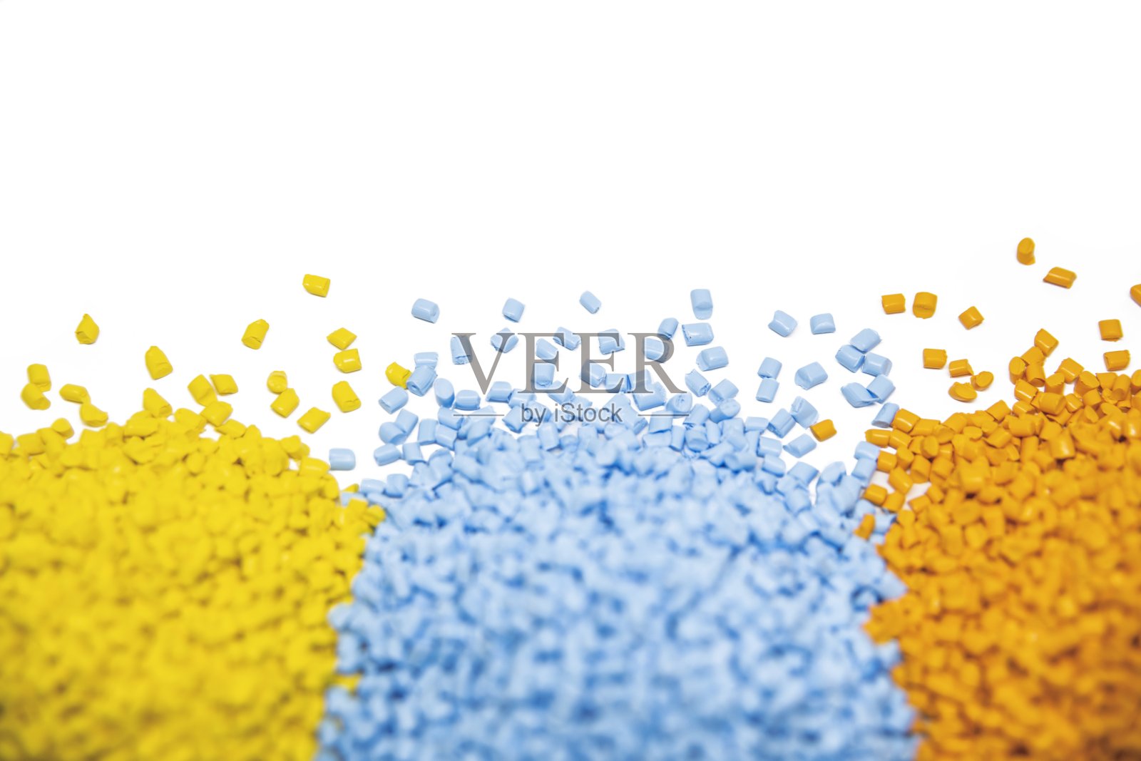 黄色和蓝色塑料聚合物颗粒照片摄影图片