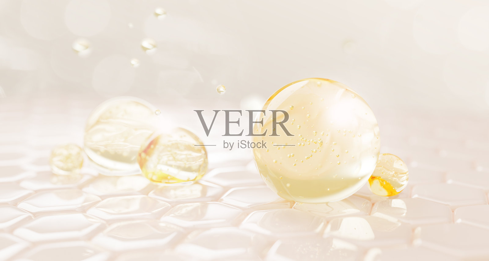 3D表皮皮肤层，带有六边形细胞图案和油滴纹理。浅色背景上有金色液体精华、胶原蛋白凝胶和视黄醇维生素气泡。护肤用的化妆品球体。照片摄影图片