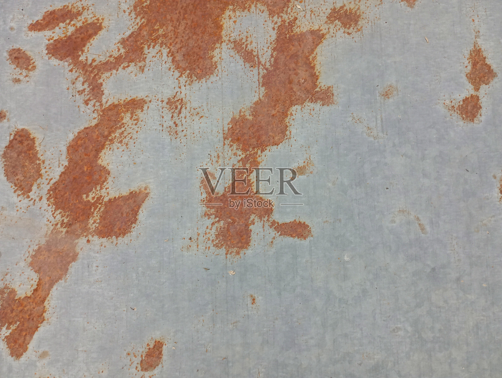 金属板表面锈迹的纹理。工业起源的纹理背景。照片摄影图片