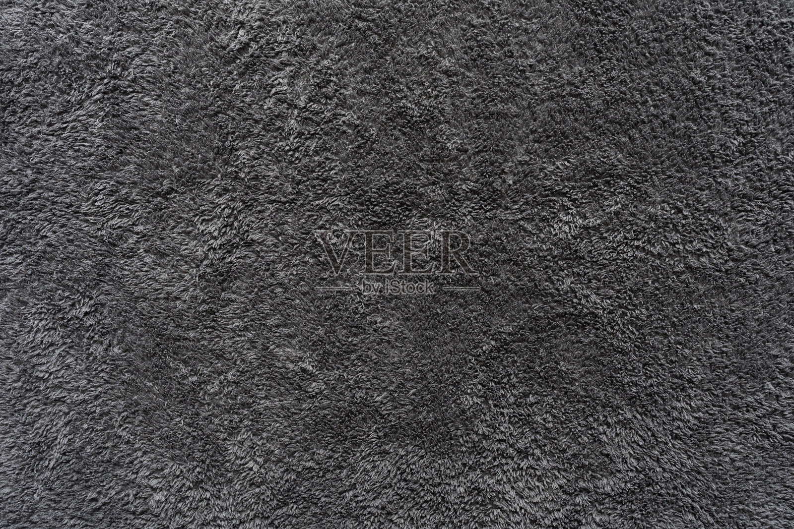 服装面料的灰色纹理背景，贴近织物表面的抽象纺织。照片摄影图片