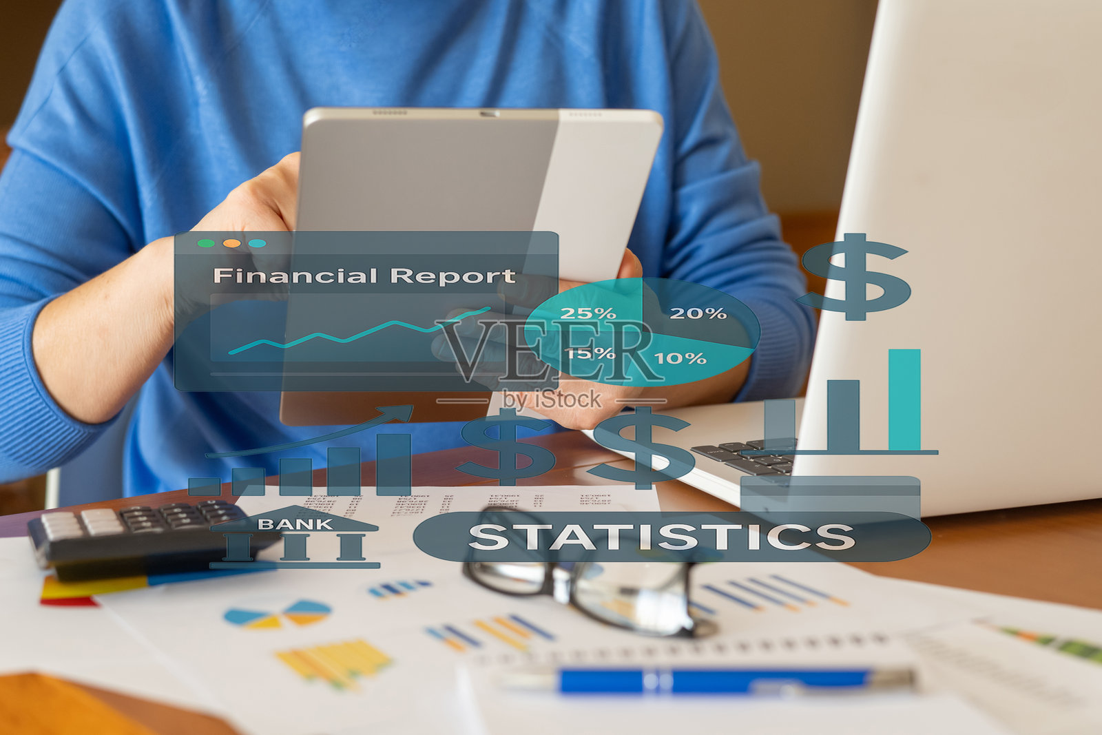 商人正在平板电脑上分析财务报告，报告中包含突出银行业绩和公司利润的图表和统计数据。照片摄影图片