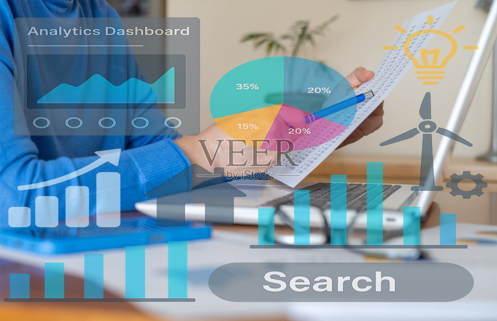 女商人正在分析数据，使用图表和图形评估绩效和可持续发展目标的进展，专注于可再生能源解决方案以实现更绿色的未来。照片摄影图片