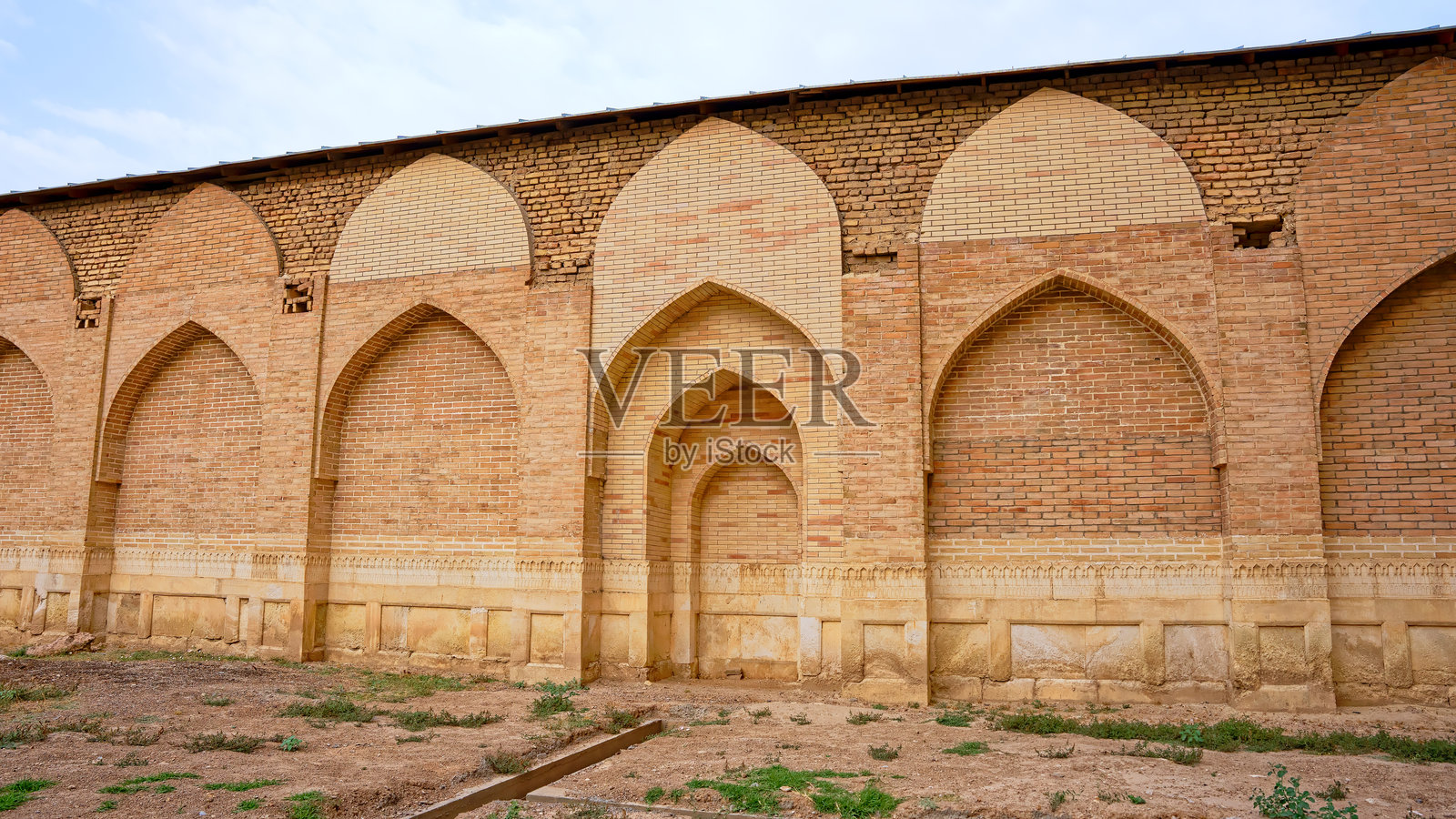 乌兹别克斯坦撒马尔罕的比比·哈尼姆清真寺纪念碑,砖墙和拱门照片摄影图片