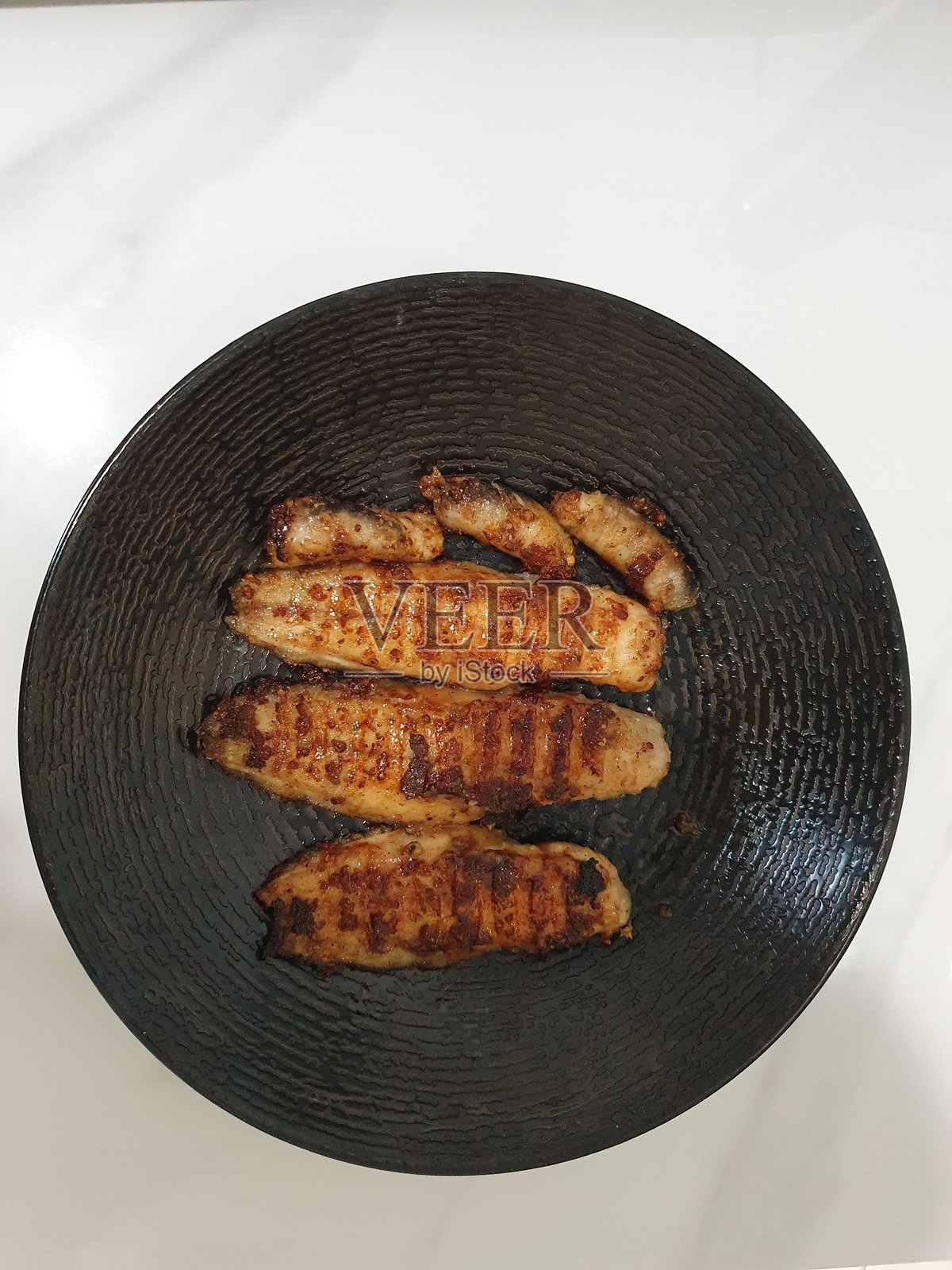 烤鲶鱼肉照片摄影图片