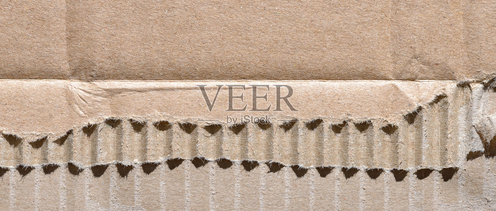 瓦楞纸板背景，棕色纹理纸幕，特写纹理细节，留有文本空白区域照片摄影图片