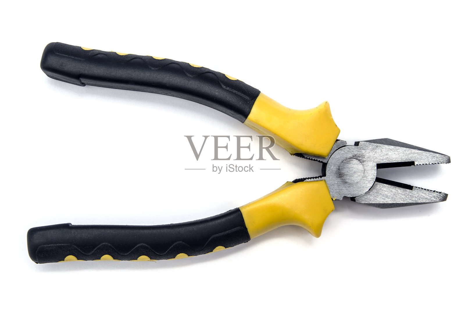 白色背景上的黄色和黑色钳子照片摄影图片