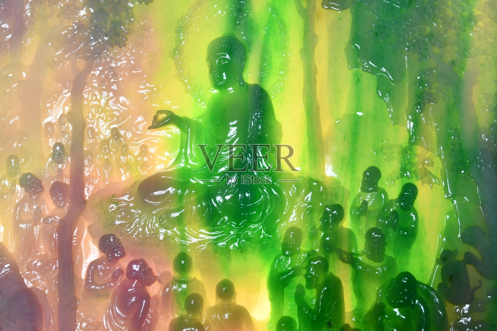 部分古代玉雕佛像弟子晶莹发亮照片摄影图片