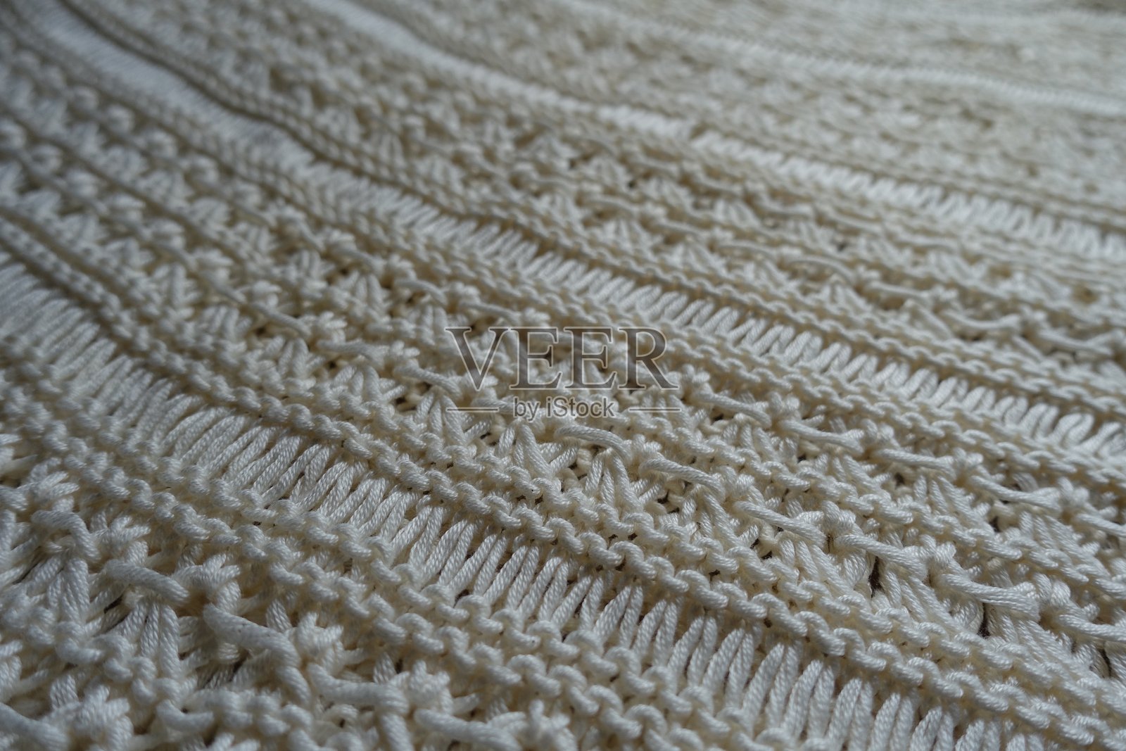 浅米色手工钩编蕾丝面料特写照片摄影图片
