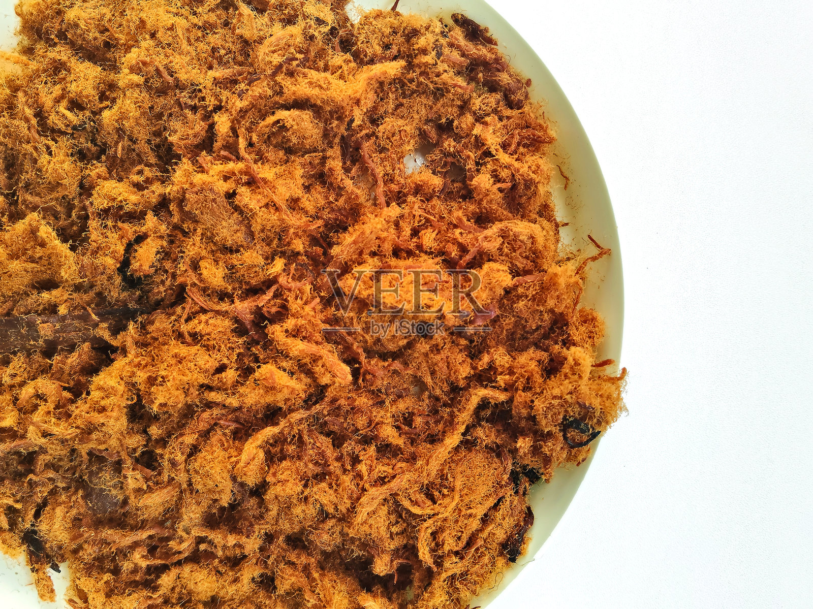 美味松软的印尼牛肉松装在容器中照片摄影图片